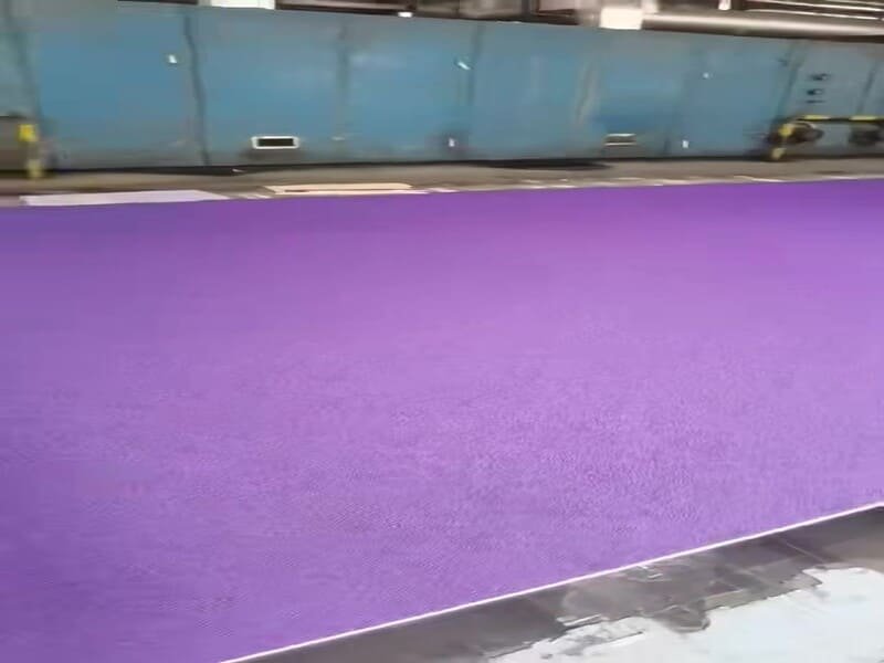 Technician inspecting subfloor conditions before PVC flooring installation